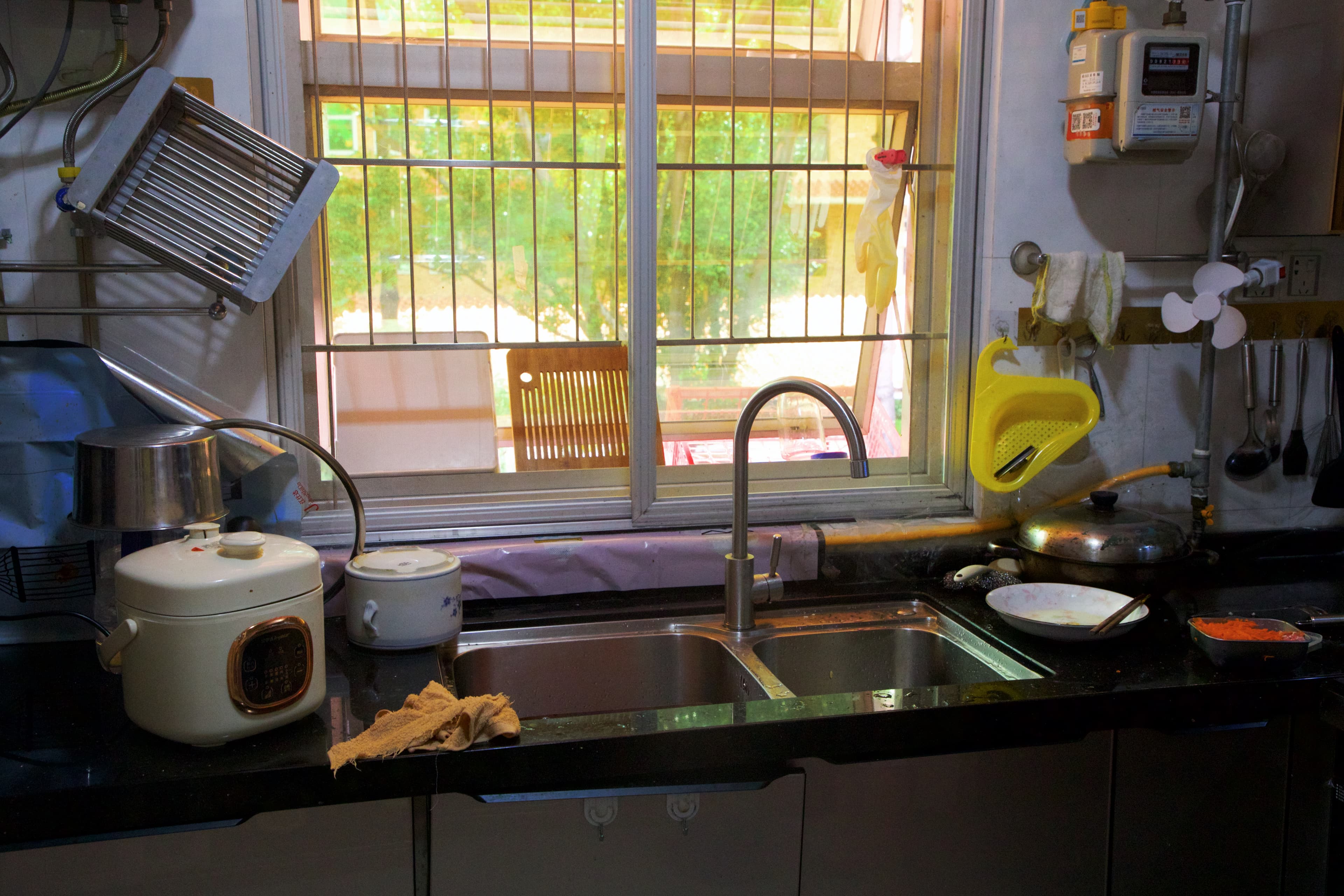 A lived-in kitchen illuminated by daylight