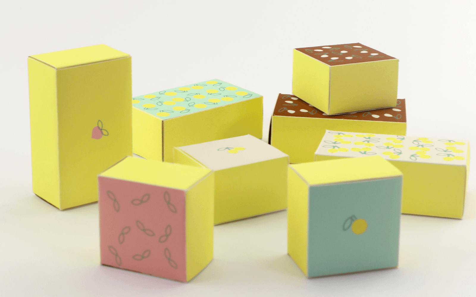 A group of colorful chocolate boxes arranged in the studio