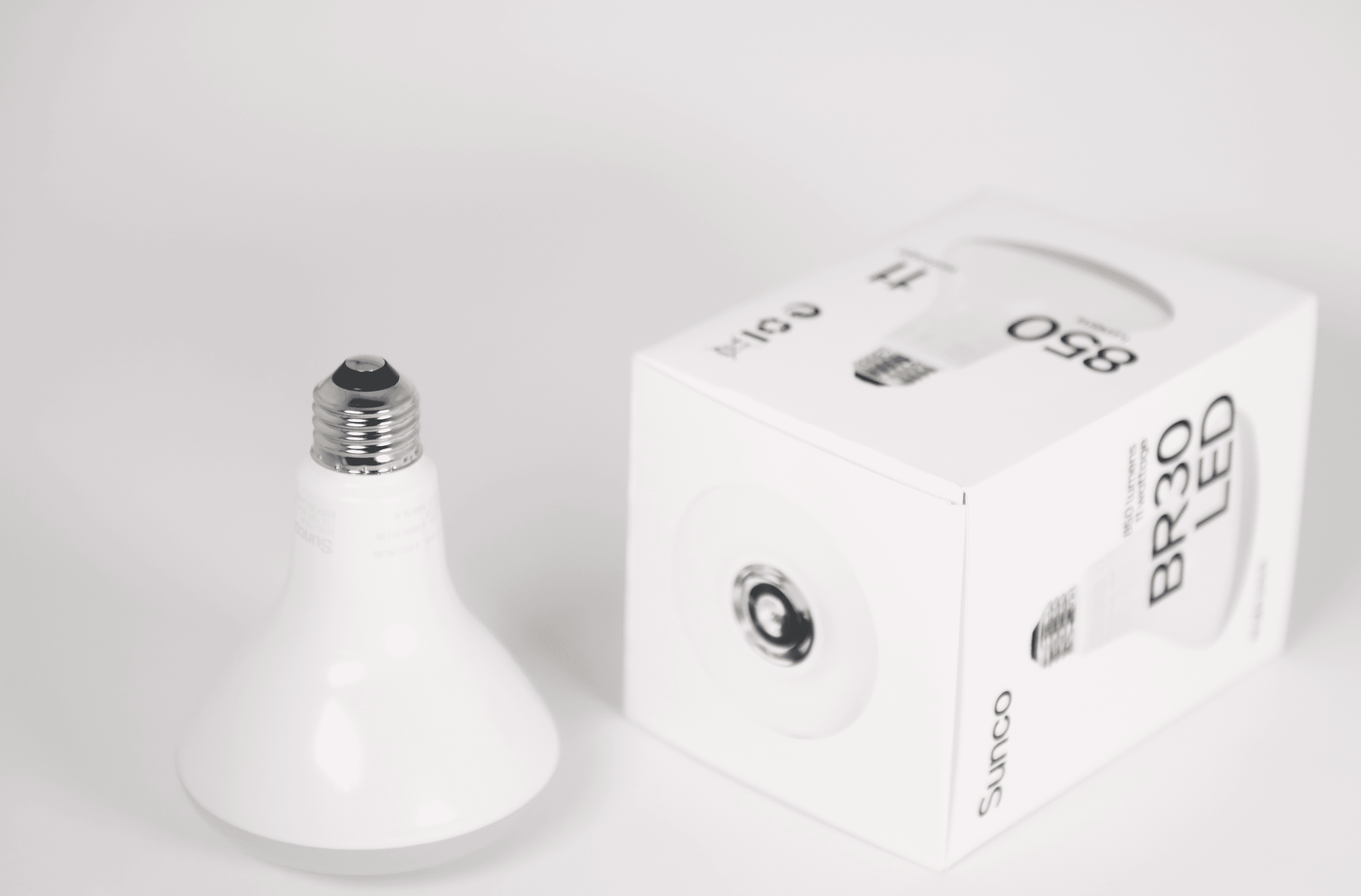 Sunco BR30 LED light bulb displayed beside its package